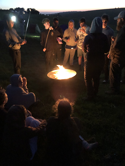 Students around the campfire