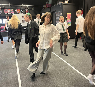 actress Josephine Rogers in the drama department with students