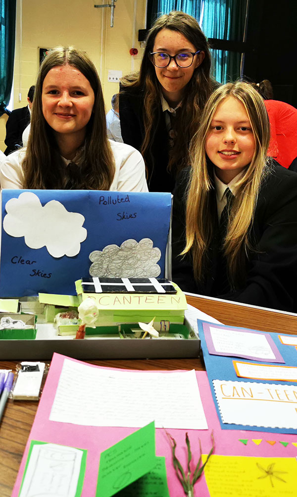 Students showing their designs
