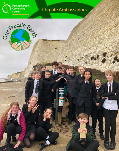 Students with the recycling point at the bottom of the cliff